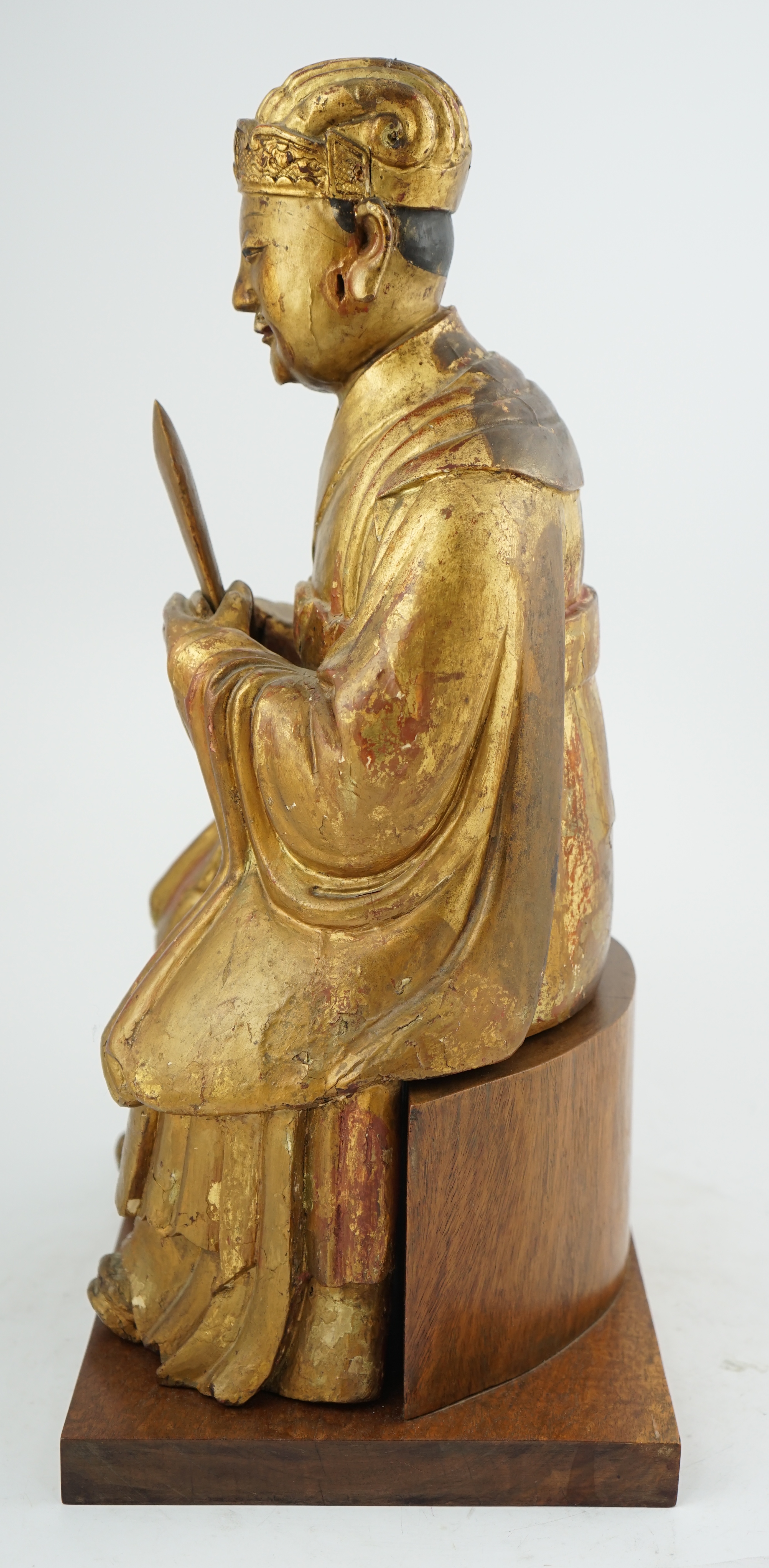 A Chinese gilt lacquered wood seated figure of Wenchang Wang, late Ming, 17th century